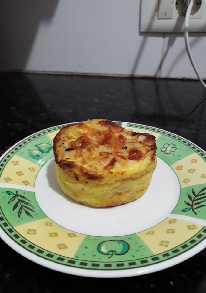 Una foto de Mini soufflé de cebolla y queso