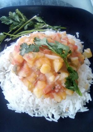 Una foto de Arroz con guiso de papa toque de cilantro