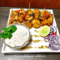 A picture of Chaat - spiced fire potatoes with hot honey drizzle and breeze minty cool dip.
