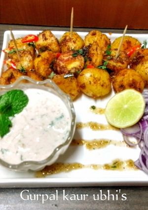 A picture of Chaat - spiced fire potatoes with hot honey drizzle and breeze minty cool dip.