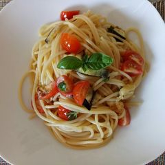 A picture of Grilled aubergine and fresh tomato pasta.