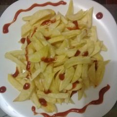 A picture of Home made chips/fries.