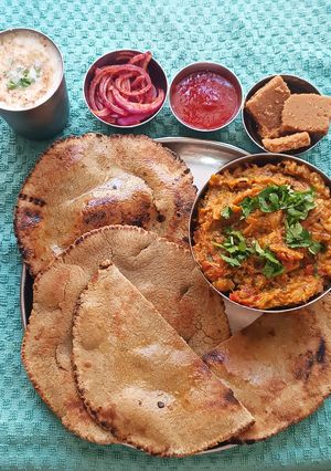 A picture of Smoky Oro with Warm Bajra Rotla – The Soul of a Gujarati Dinner.