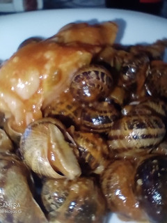 Una foto de Caracoles con pies de cerdo