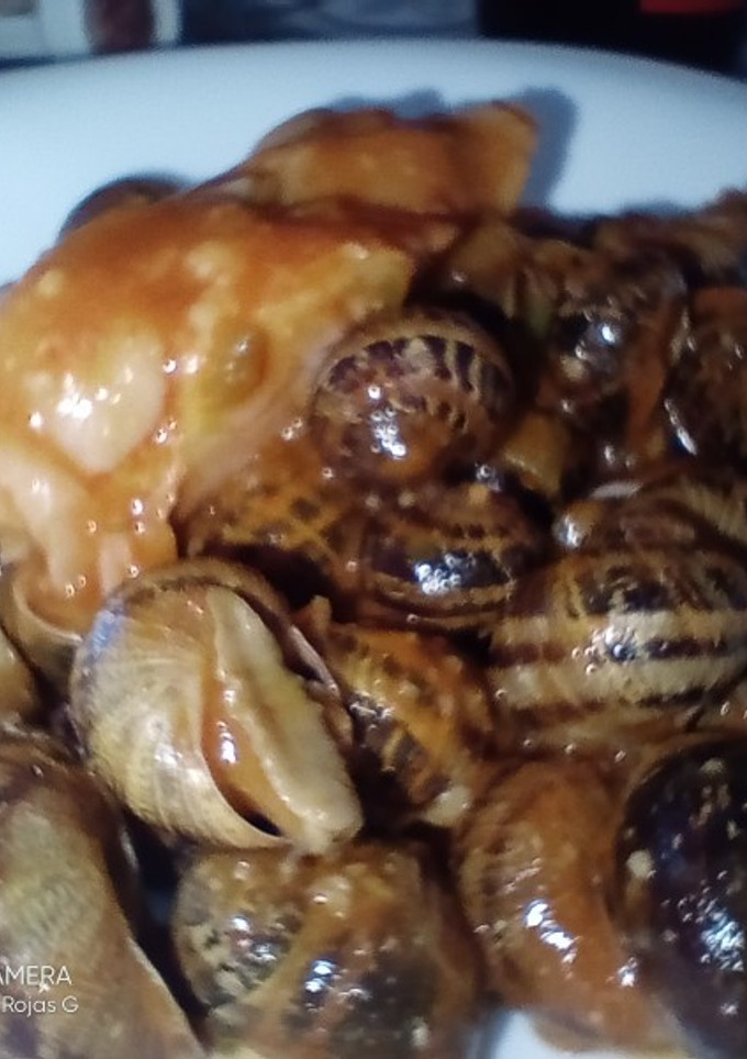 Una foto de Caracoles con pies de cerdo