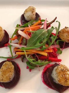 A picture of Seared Scallops with Beet Vinaigrette.