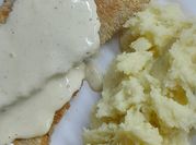 Una foto de papa al horno con ciboulette