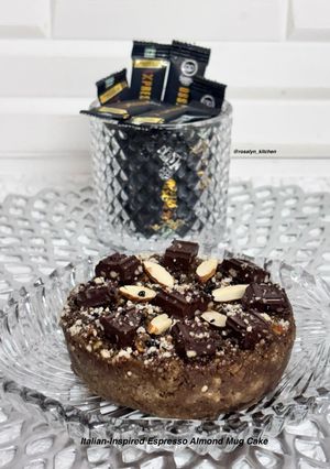 A picture of ☕🌍🍫 Italian-Inspired Espresso Almond Mug Cake | Rich Coffee Flavor & Chocolate Almond Topping.