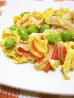 A picture of Scrambled Eggs with Imitation Crab and Edamame.