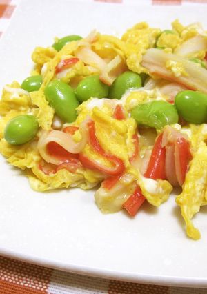 A picture of Scrambled Eggs with Imitation Crab and Edamame.