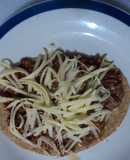 Huarache  asado de birria de pollo adobada al tequila con queso tipo San Diego.  Jalisco México
