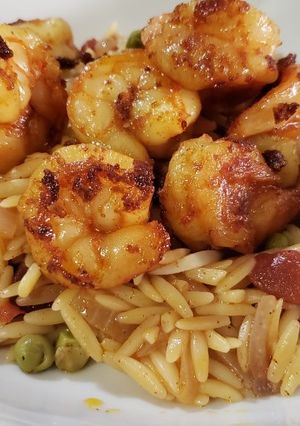 A picture of Orzo pasta with shrimp.