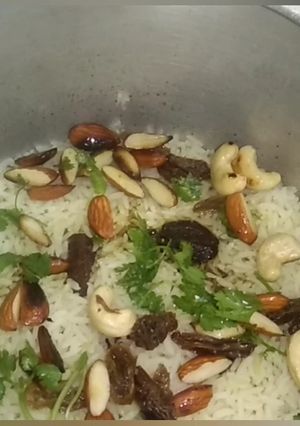A picture of Birayani  With  Dry  Fruits  In  Pressure Cooker.