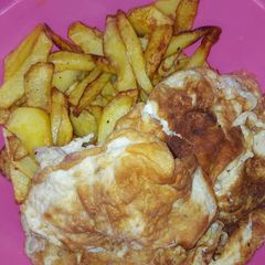 A picture of Fried potatoes with egg.