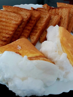 A picture of Cloudy Egg with Toasted Bread.