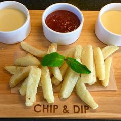A picture of French Fries With Cheesy Sauce.