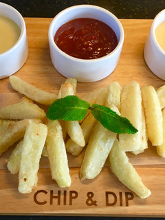 A picture of French Fries With Cheesy Sauce.