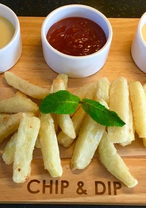 A picture of French Fries With Cheesy Sauce.