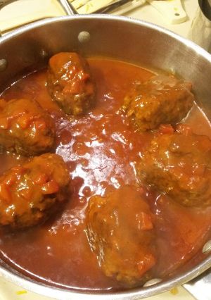 A picture of Beef Croquettes in Tomato Gravy.