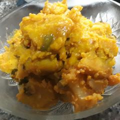 A picture of Yam and sweet potatoes porriage with scent leaves.
