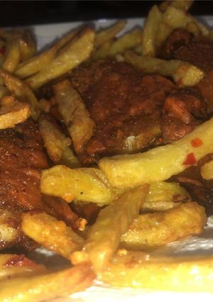 A picture of Masala French fries with any fried item.
