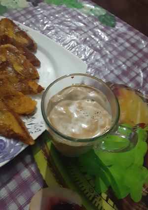 A picture of French toast with creamy coffee.