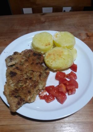 Una foto de Milanesas con papas a la crema