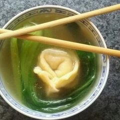 A picture of Home made wonton soup with fresh bok choy.