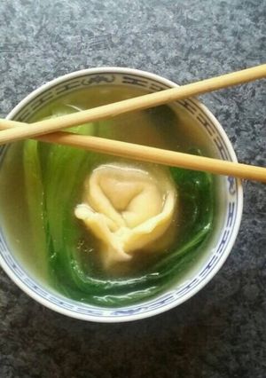 A picture of Home made wonton soup with fresh bok choy.