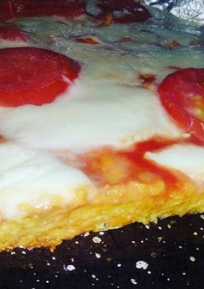 Una foto de Pizza con masa de zanahoria