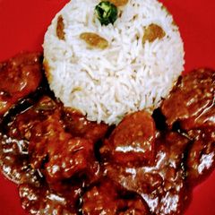 A picture of Shahi malai chicken with bengali mishti rice.
