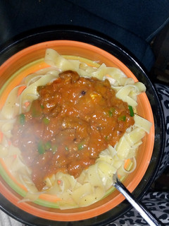 A picture of Pasta served with beef curry.
