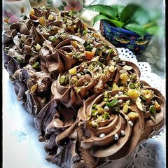 A picture of Tahini Chocolate Cake with Coconut Chocolate Mousse frosting.