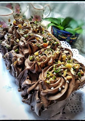 A picture of Tahini Chocolate Cake with Coconut Chocolate Mousse frosting.