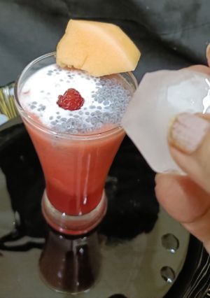 A picture of Rose melon Shake with coconut and sabja.