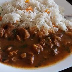 A picture of Stewed Beef served with rice.