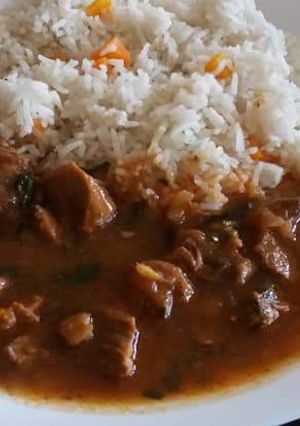 A picture of Stewed Beef served with rice.
