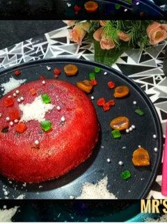 A picture of Red Velvet Cake with Strawberry and Coconut flavour (Eggless).