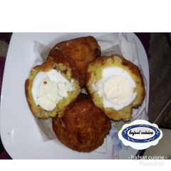 A picture of Egg in potato.