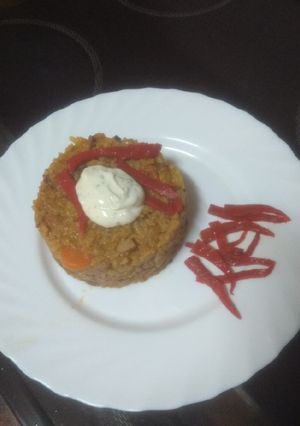 Una foto de Arroz con chocos y mejillones con alioli