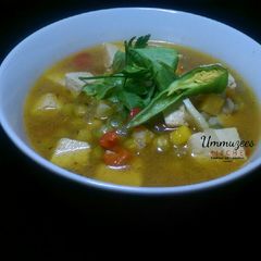A picture of Tofu and vegetable soup.