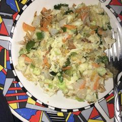 A picture of Fried eggs with cabbage.