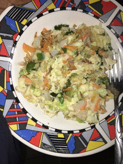 A picture of Fried eggs with cabbage.