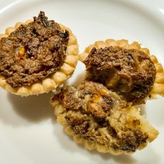 A picture of Mushroom and blue cheese tarts.