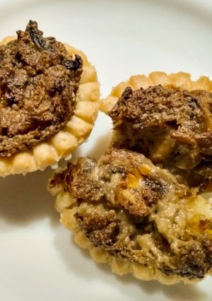 A picture of Mushroom and blue cheese tarts.