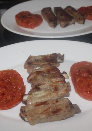 A picture of Double Grill Pork Ribs with Tomato.