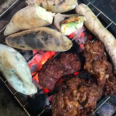 A picture of Roasted potatoes and meat.