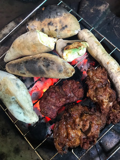 A picture of Roasted potatoes and meat.
