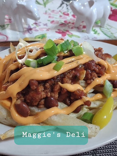 Una foto de Chili cheese fríes