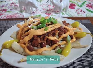 Una foto de Chili cheese fríes